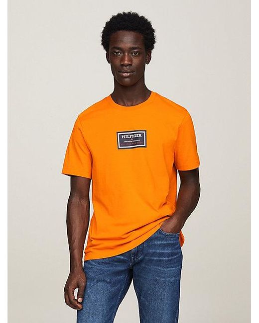 Camiseta de punto con logo estampado Tommy Hilfiger de hombre de color Orange