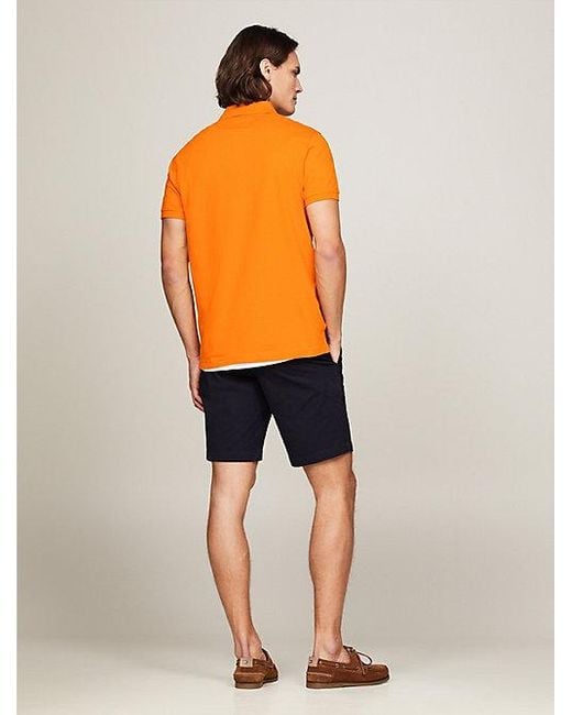 Tommy Hilfiger Regular Fit Poloshirt mit rundem Logo in Orange für Herren
