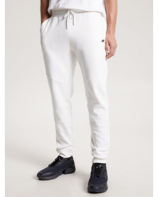 Tommy Hilfiger Sport Essential Tonal Logo Cuffed Joggers in White for Men |  Lyst UK