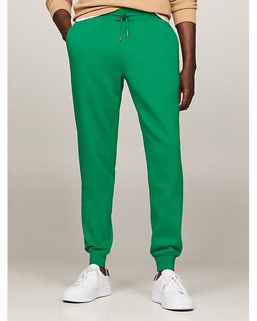 Joggers con logo y pernera recta Tommy Hilfiger de hombre de color Green