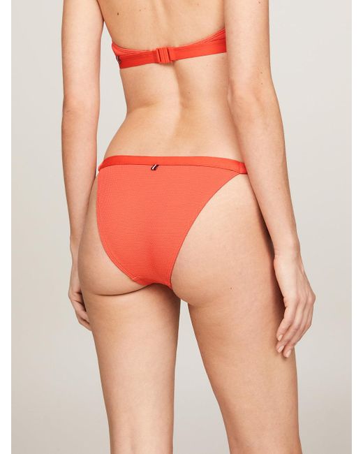 Bas de bikini ton sur ton à nouer à logo Tommy Hilfiger en coloris Orange