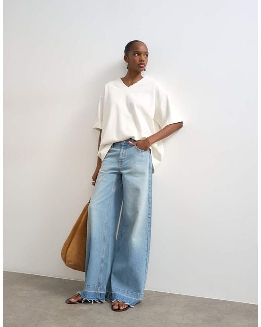 TOPSHOP Blue Horizon Mid Rise Wide Leg Jean With Let Down Hem Detail