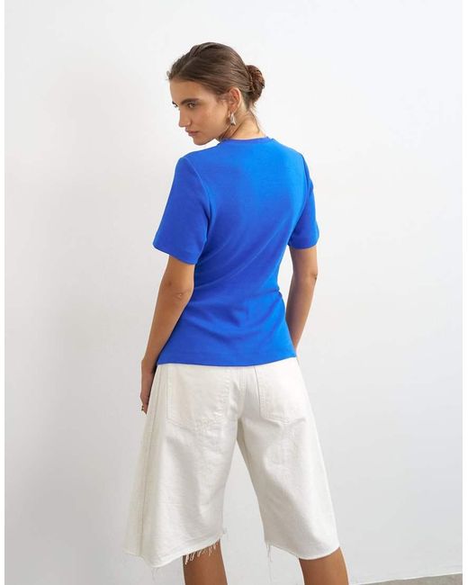 TOPSHOP Blue Fringed Wrap Front Tassel Hem Tee
