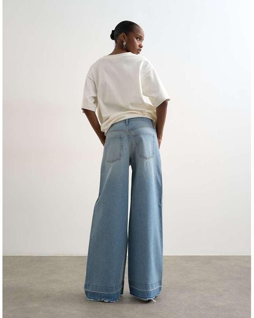 TOPSHOP Blue Horizon Mid Rise Wide Leg Jean With Let Down Hem Detail