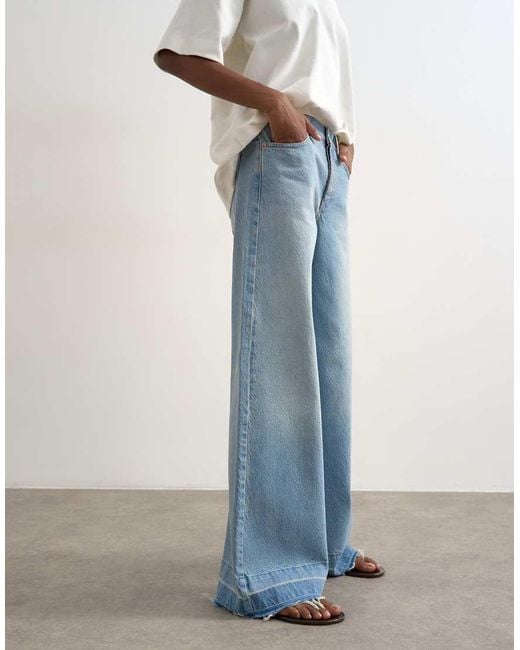 TOPSHOP Blue Horizon Mid Rise Wide Leg Jean With Let Down Hem Detail