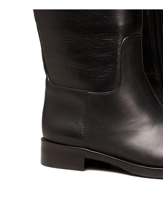 tory burch black riding boot
