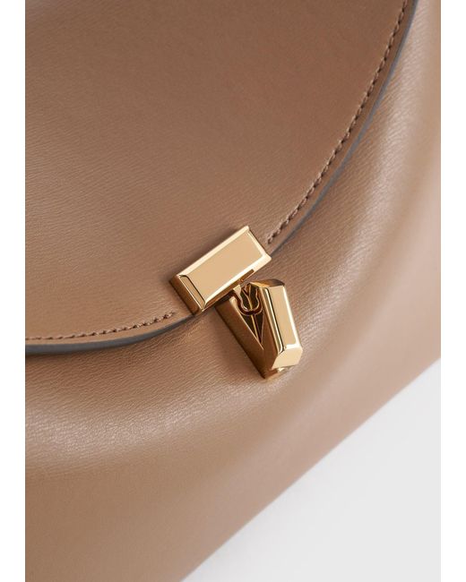 Totême  Natural T-Lock Leather Clutch