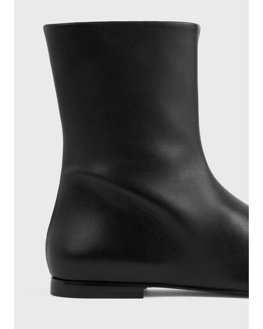 Totême Black Zipped Leather Chelsea Boots