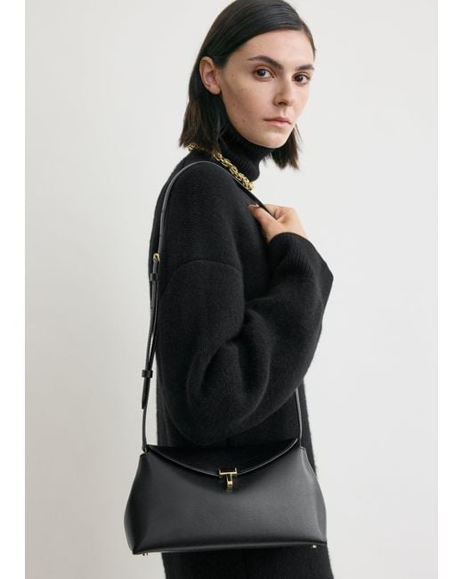 Totême Black T-Lock Leather Clutch