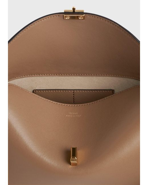 Totême  Natural T-Lock Leather Clutch