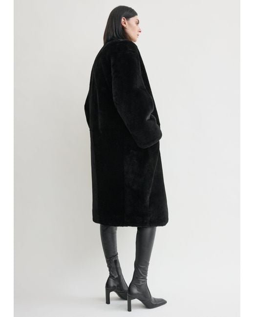 Totême  Black Collarless Shearling Coat