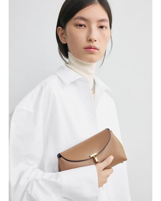 Totême White Mini T-Lock Leather Clutch