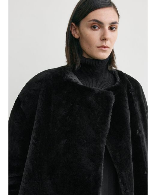 Totême Black Collarless Shearling Coat