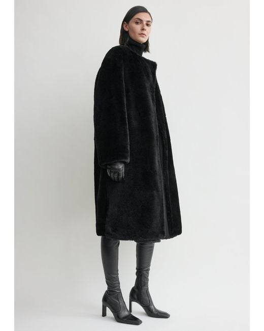 Totême  Black Collarless Shearling Coat
