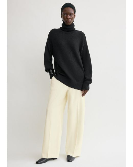 Totême  Black Longline Turtleneck