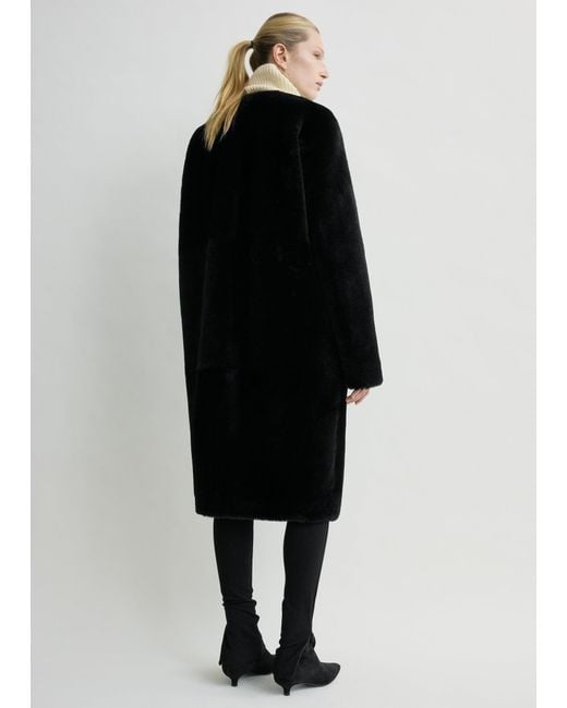 Totême Black Shearling Midi Coat