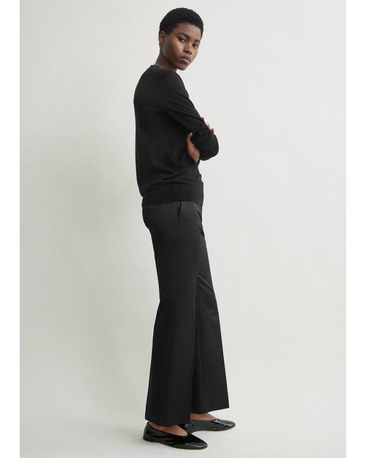 Totême  Black Kick Flare Raw-Edge Trousers