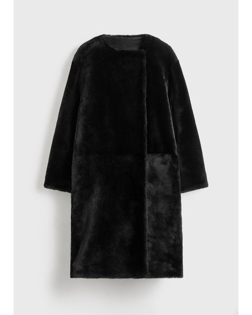 Totême Black Collarless Shearling Coat