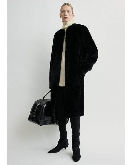 Totême Black Shearling Midi Coat