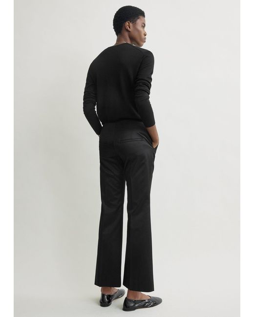 Totême  Black Kick Flare Raw-Edge Trousers