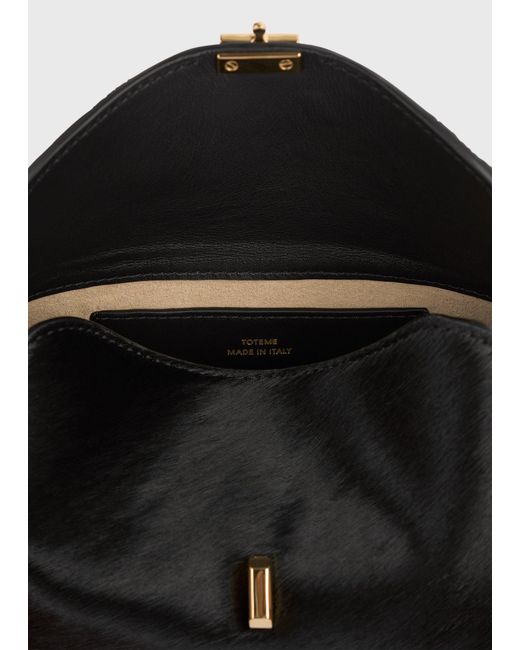 Totême White Mini T-Lock Pony Hair Clutch