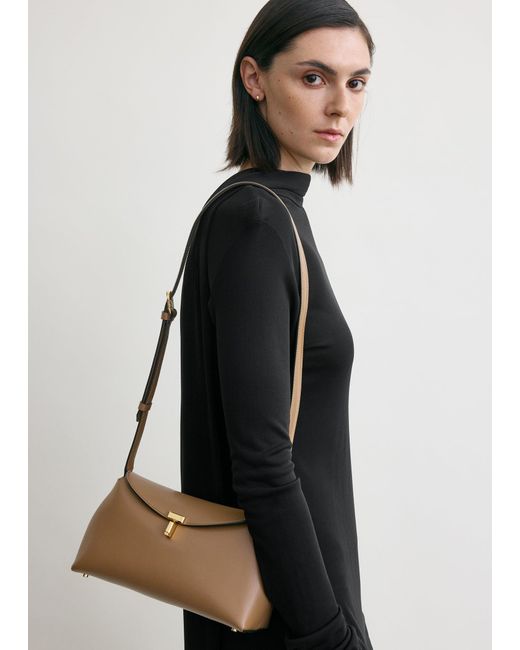 Totême  Natural T-Lock Leather Clutch