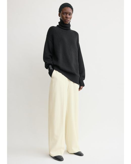 Totême Black Longline Turtleneck