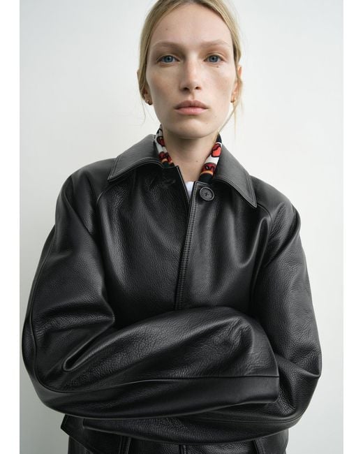 Totême Black Raglan Leather Coat