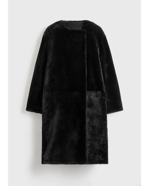 Totême Black Collarless Shearling Coat