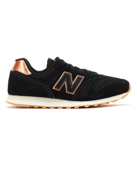 new balance 373 sneakers in black and rose gold