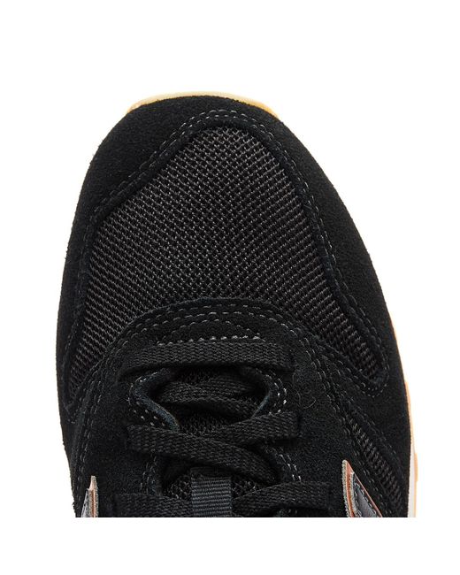 new balance 373 sneakers in black and rose gold