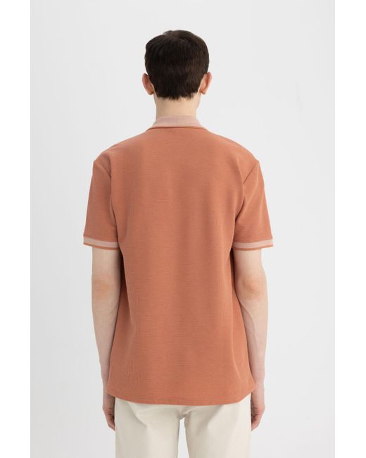 Defacto Neues polo-t-shirt mit normaler passform und kurzen ärmeln in Orange für Herren