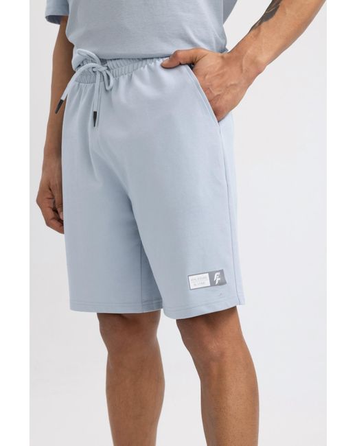 Defacto Fit slim fit shorts mit kurzem bein in Blue für Herren