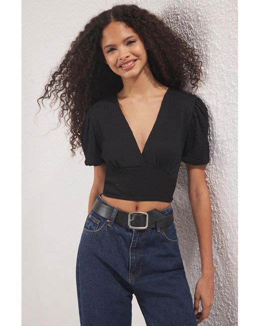 Trendyol Black Schwarze, Strukturierte, Zweireihige, Baumelnde Strickbluse Mit V-Ausschnitt Und Ballonärmeln Für Damen