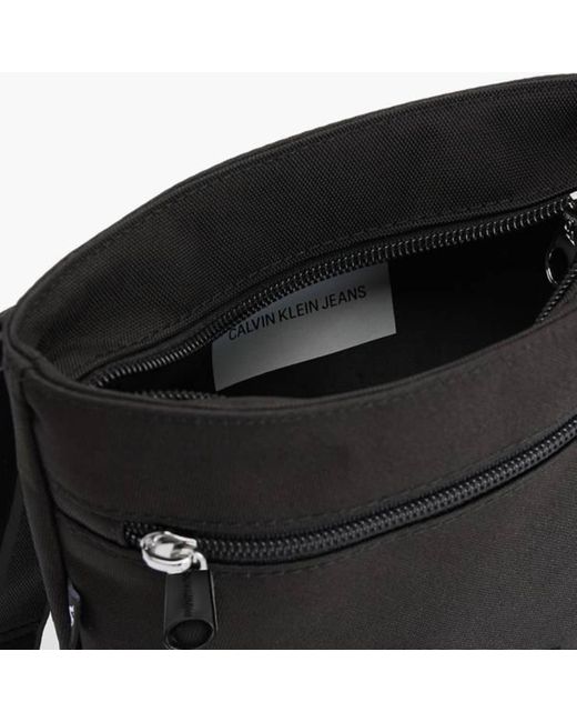 Calvin klein flat online cross body bag