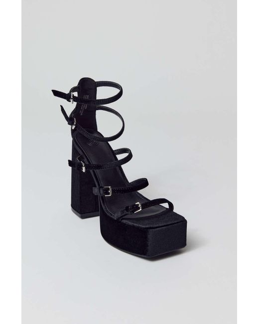Woman's platform sandal with strap in black leather heel 11
