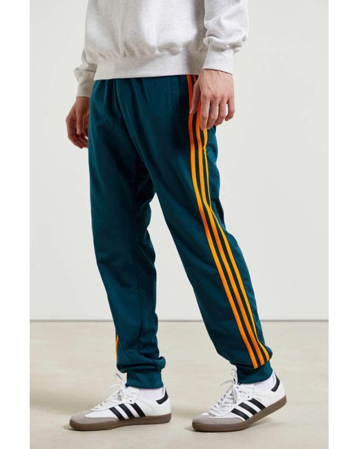 adidas originals three stripe track pant in blue