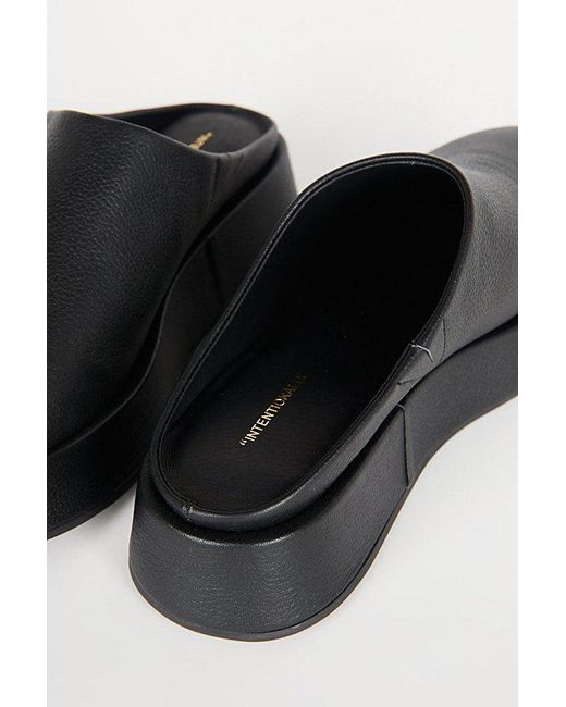 INTENTIONALLY ______ Black Risen Leather Platform Mule