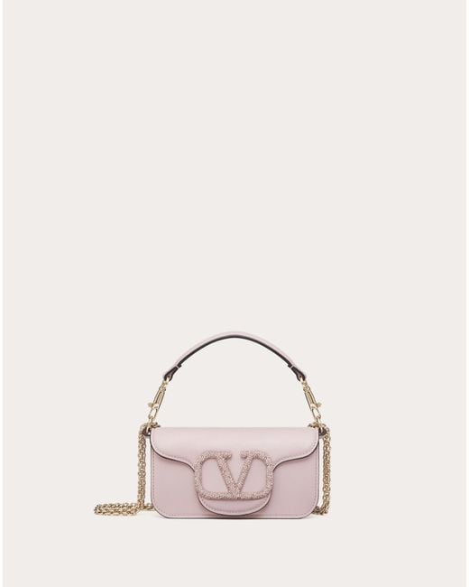 Valentino Garavani Locò Small Shoulder Bag With Jewel Logo in Pink