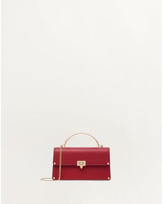 Valentino Garavani ロックスタッズ カーフスキン ミニ ハンドバッグ 女性 ロッソ ヴァレンティノ Red