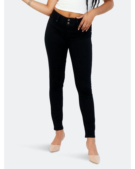 1822 Denim Curvy Double Button Skinny Denim Jeans, Black | Lyst