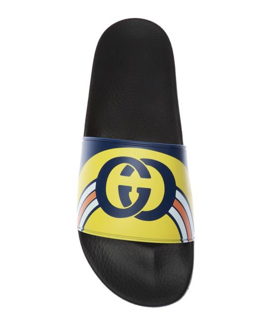 blue and yellow gucci slides
