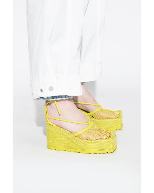 yellow wedge pumps
