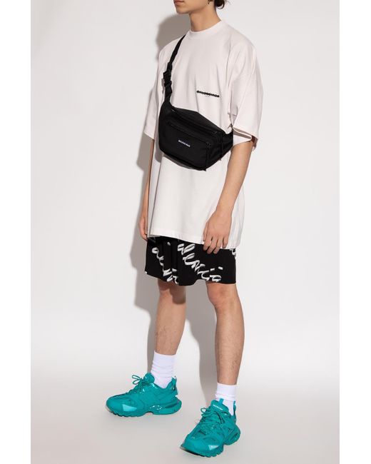 white tee balenciaga man bag