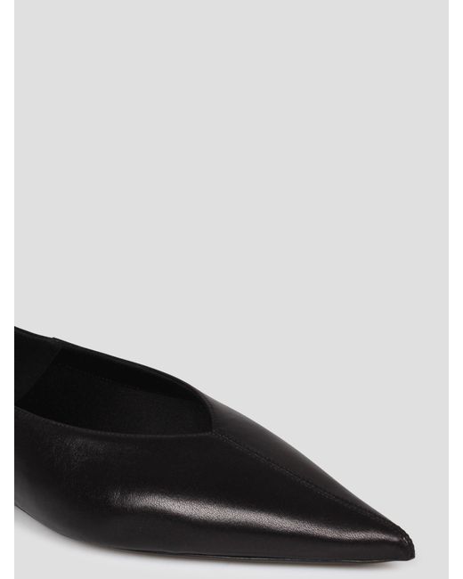 Carolyn vamp slippers di Saint Laurent in Black