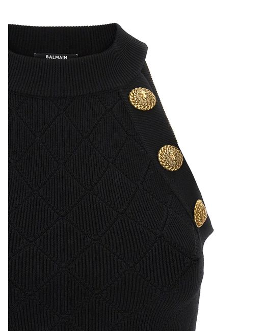 Crop top in maglia con bottoni goffrati di Balmain in Black