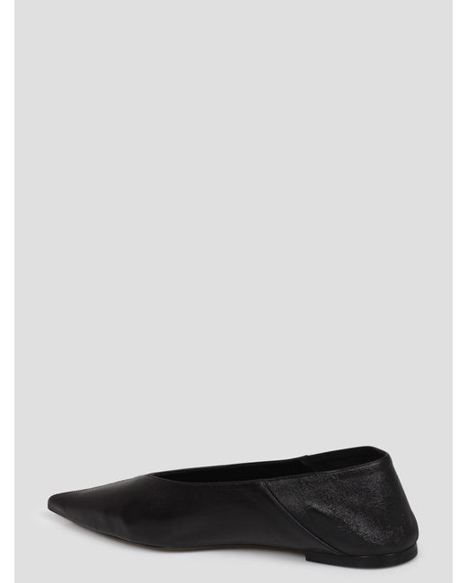 Carolyn vamp slippers di Saint Laurent in Black