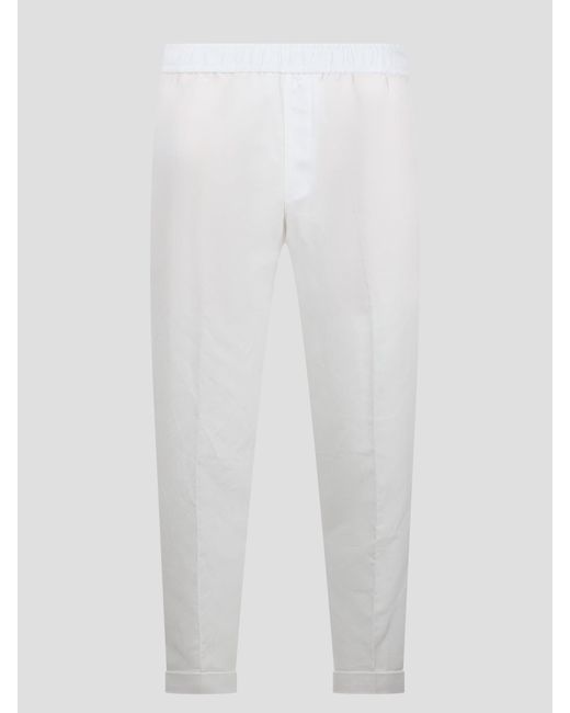 Rem slim low rise elastic waistband trousers di Neil Barrett in White da Uomo