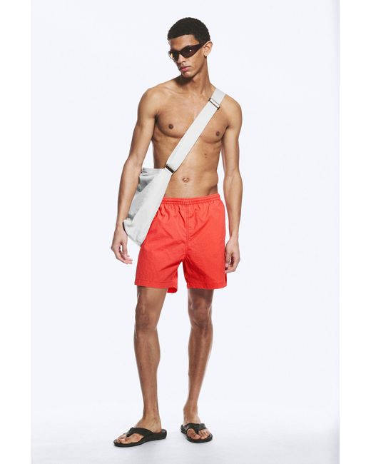 Weekday Red Ed Bleached Swim Shorts for men