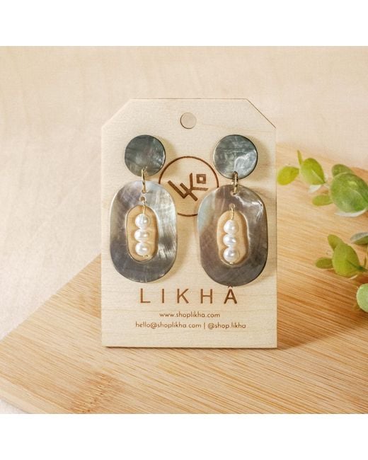 LIKHÂ Black Oval Earrings With Inner Pearls